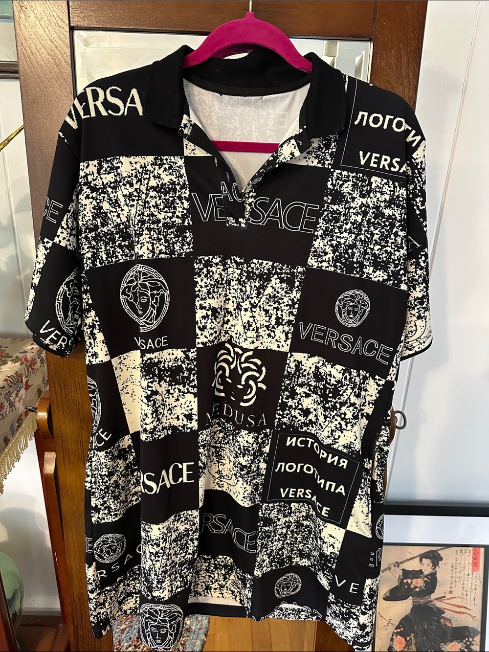 Striking and Daring Ladies Black and White Logo Checker Polo Lounge Wear